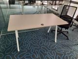 tables and chairs in an office with glass walls and blue carpet