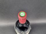 a bottle of wine that is sitting on a table