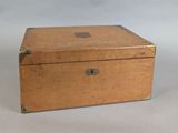a small wooden box with a lock on it