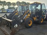 a picture of a backhoe and a loader in a parking lot