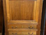 an image of a wooden cabinet with drawers and a marble top