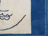 a rug with a picture of a cat on it