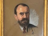portrait of a man with a beard in a gold frame