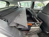 the back seat of a car with a box in the back of it