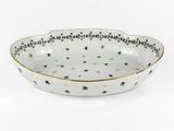 un bol noir et blanc orné d'étoiles