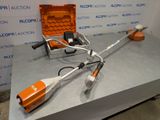 an orange and white corded stringing machine sitting on top of a table