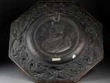a black plate with a picture of a man on it