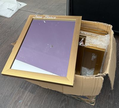 a cardboard box with a picture in it sitting on the floor
