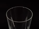 a close up of a clear glass on a black background