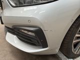 a close up of a car with a denting on it