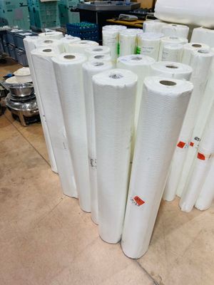 several rolls of white paper are stacked on top of each other