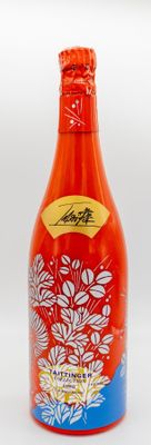 a red bottle with a blue and white design on it