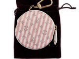 pink and white striped coin purse with a gold keychain