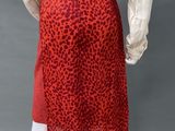 a woman ' s red leopard print skirt and blouse on a mannequin mannequin mannequin mannequin mannequin mannequin manne