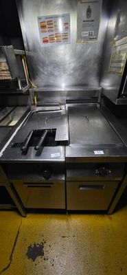 an image of a commercial kitchen with a lot of counter space