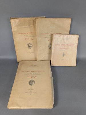 three books sitting on top of a table next to each other