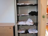 a closet with a lot of clothes in it