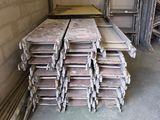 a large pile of wood sitting in a room