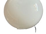 an image of a white light bulb on a stand