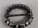 an image of a metal ring with spikes on it