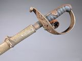 a very old looking sword with a very long handle