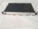 a black and white picture of a laptop on a bed