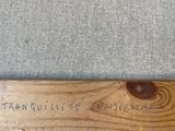 a close up of a wooden baseball bat with writing on it
