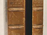 two old books on display in a glass case