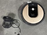 a robot that is sitting on the floor next to a charger
