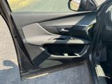 the door of a car with the driver ' s side door open