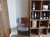 a chair in the corner of a room next to a bookcase