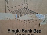 cardboard box containing a single bunk bed with a sleigh bed frame