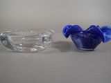 two glass bowls sitting next to each other on a table