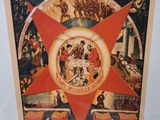 a picture of a red star hanging on a wall