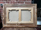 a picture of an old picture frame on a table