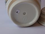 a close up of a coffee cup and a stack of coasters