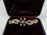 an image of a diamond ring in a velvet box on a table