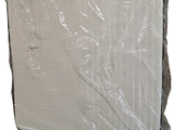 a mattress that is wrapped in plastic on a white background