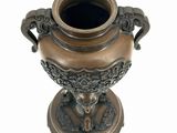 an image of a bronze vase on a white background