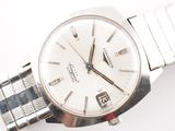 an image of a close up of a wrist watch on a white surface