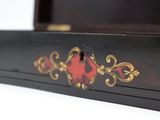 a black box with a red heart on it