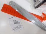 a pair of scissors sitting on a table next to a piece of plastic