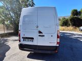 a white van that is parked on the side of the road