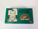 an image of a box of green house cigarettes sitting on a table