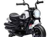 a black and white motorcycle with a light on it