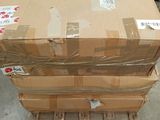 boxes stacked on top of each other on a pallet in a warehouse