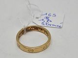 a gold ring with a chain attached to it