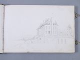 an open book with a drawing of a castle on it