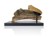 a piece of wood that is on a stand