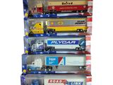 six camions miniatures dans une vitrine sur fond blanc